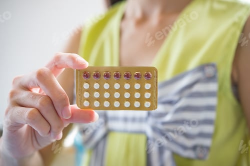 Preview: Woman hand holding a contraceptive panel prevent pregnancy