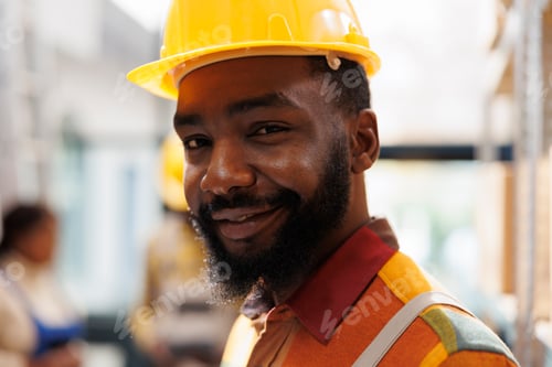 Preview: Smiling african american young warehouse handyman face portrait
