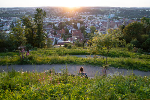 Preview: Woman relaxing in the city of Ravensburg, picture taken at the Veitsburg.
