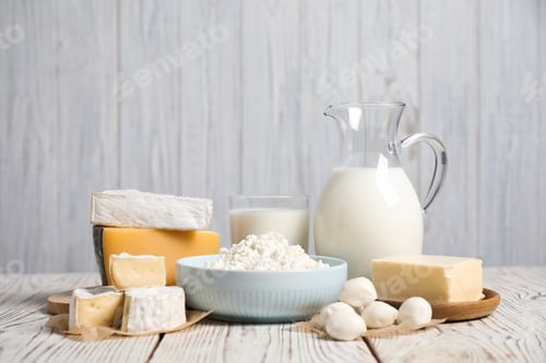 Preview: Different delicious dairy products on white wooden table
