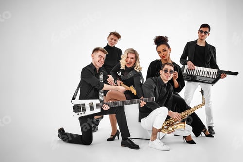 Preview: photo of multi ethnic music band in studio.Musicians and woman soloist posing over white background