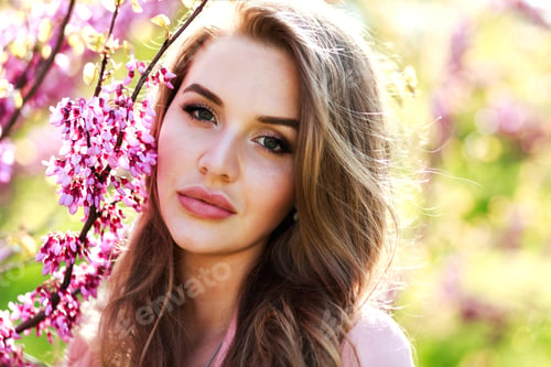 Preview: Attractive pretty young woman in light white dress, pink coat, with long hair