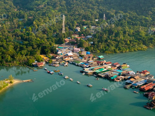 Preview: Top down aerial view of wooden houses and walkways in Bang Bao village,