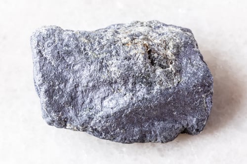 Preview: sample of rough molybdenite mineral on white