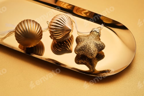 Preview: Christmas tree toys on a golden tray.
