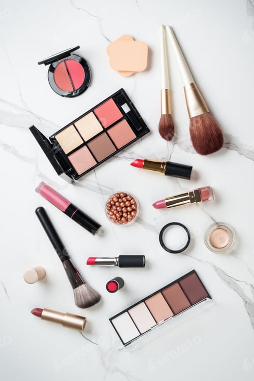 Preview: Make up products at white marble background.