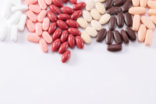 Preview: Closeup shot of many different medical pills isolated on a white background