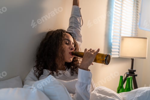 Preview: Drunk Latino woman hold beer bottle, feel hangover and dancing on bed.