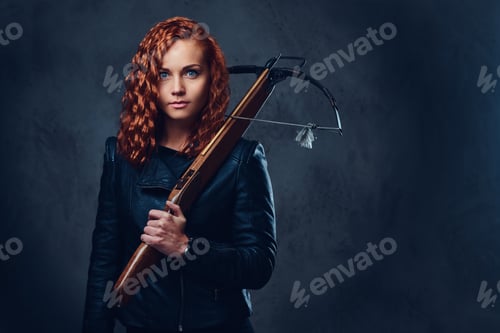 Preview: Redhead female holds crossbow.