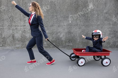 Preview: Happy woman and child going to work outdoor