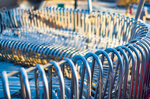 Preview: Close-up street bench metal pipes arranged parallel