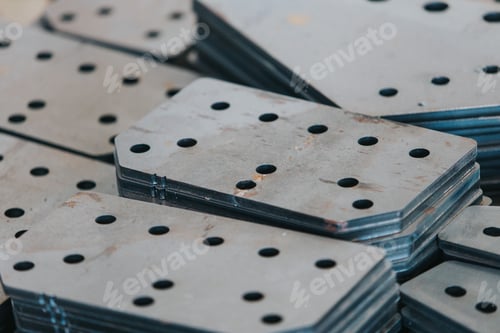 Preview: Bunch of different kinds of connecting plates stacked in neat piles
