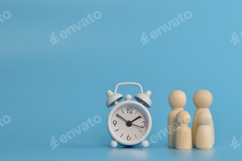 Preview: Family doll figures with clock on blue background. Family time concept.