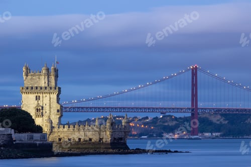 Preview: Belem Tower and 25th of April Bridge at Evening Twilight. Lisbon, Portugal