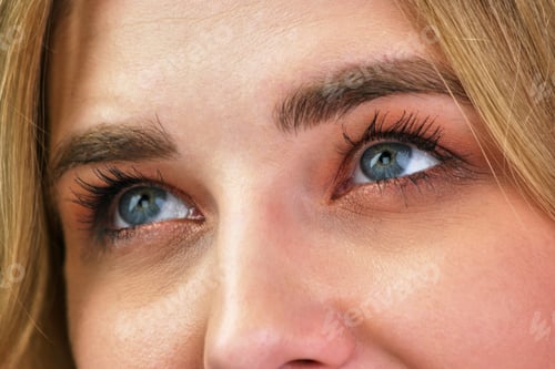 Preview: Woman's blue eyes look left and up.