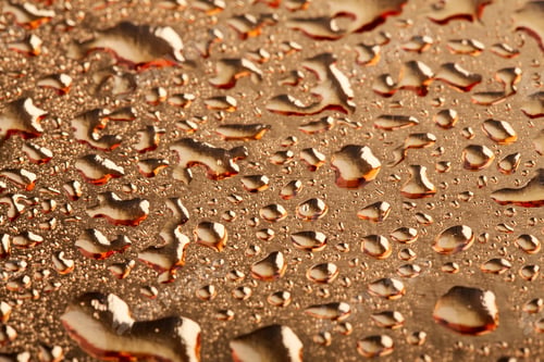 Preview: Colored Water Droplets On A Gold Background. Abstract Liquid Sprays