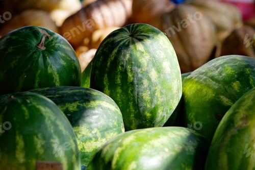 Preview: Watermelon at sn outdoor farmers market fresh fruit with natural light and melons in background