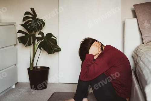 Preview: Woman sitting cover her head with hands. Mental crisis, depression