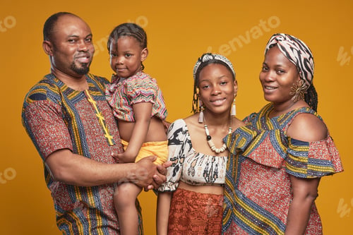 Preview: African family of four in national costumes