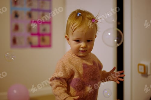 Preview: Baby girl with balloons and bubbles around her