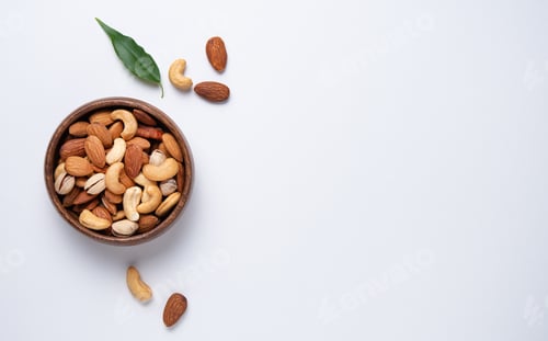 Preview: nuts almonds and cashews are placed in a wooden bowl on a light blue background