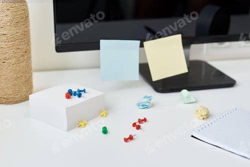 Preview: Workplace with office supplies and sticky notes on a table