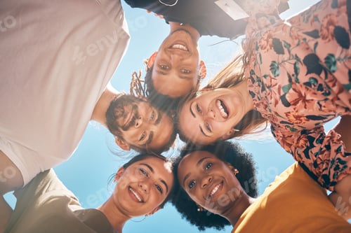 Preview: Friends, diversity and huddle with a man and woman group standing outdoor together on a blue sky in