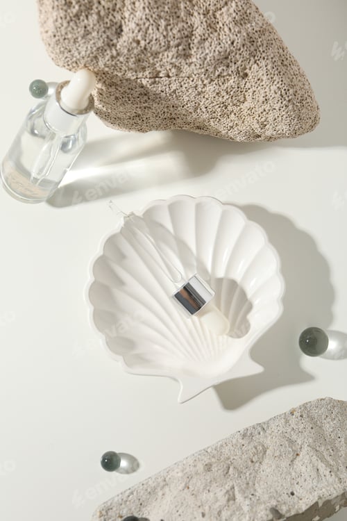 Preview: Cosmetic oil in a transparent bottle with a stone