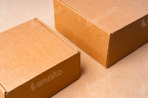 Preview: Cardboard box on beige background in studio