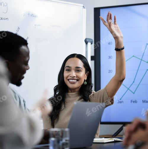 Preview: Shot of a businesswoman raising her hand during a business meeting with her colleagues