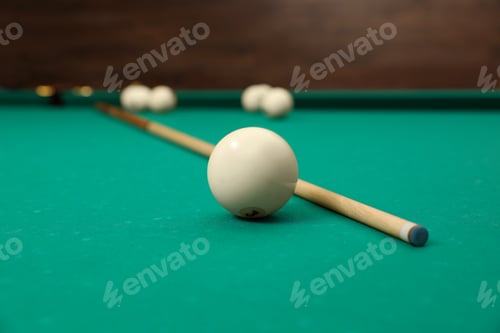 Preview: Billiard balls and cue on table indoors