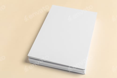 Preview: Blank stack of paper on a light surface in a simple setting without distractions