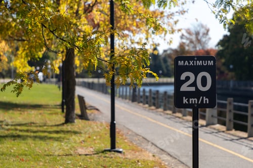 Preview: Maximum 20 km h speed limit sign on Rideau Canal pathway in Ottawa, Canada