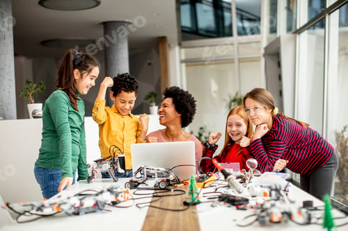 Preview: happy kids with their African American female science teacher with laptop