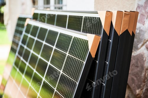 Preview: Close-up new solar panels with protective cardboard corners ready for installation.