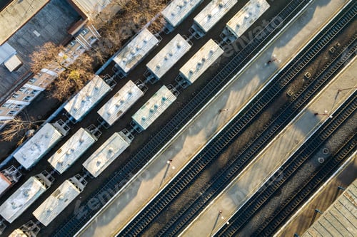 Preview: Top down aerial view of many cargo train cars on railway tracks