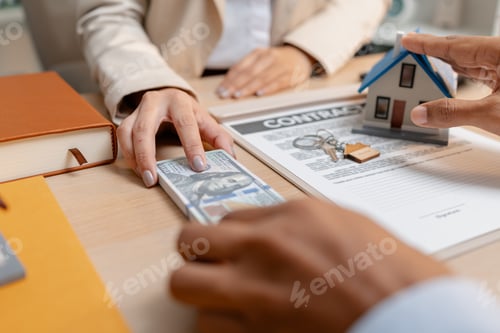Preview: A real estate agent presents a property sale contract to a client