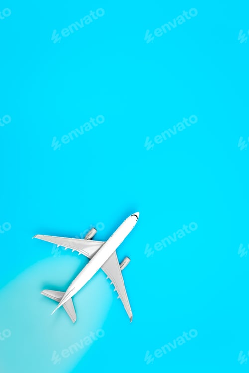 Preview: White plane, airplane on a blue background, flat lay, copy space.