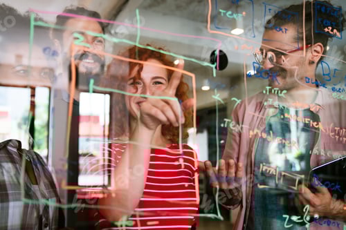 Preview: Software engineers working together on project at tech startup. Business designers working together