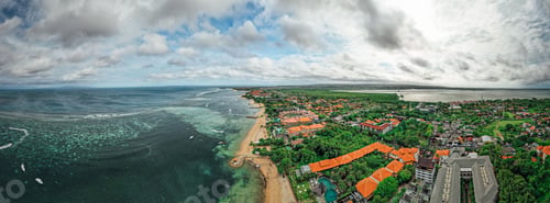Preview: Aerial view of a luxurious coastal resort located on a sunny beach of a tropical island in Indonesia