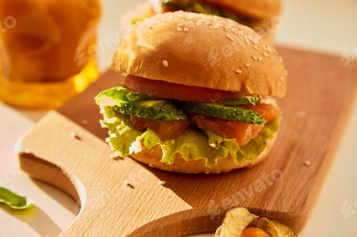 Preview: Healthy alternative of classical american hamburger - fish burger with salmon, cucumbers, tomatoes