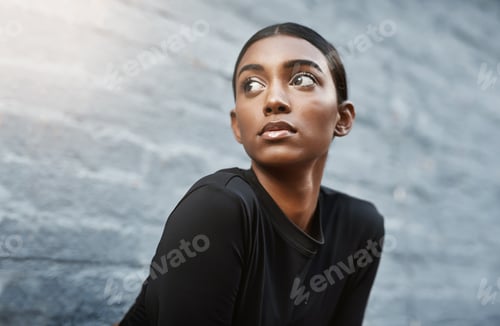 Preview: Today is another day to get stronger. Shot of a fit young woman getting ready to workout outdoors.