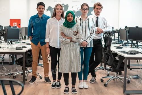Preview: Portrait of young excited multiethnics business team of software developers standing and looking at