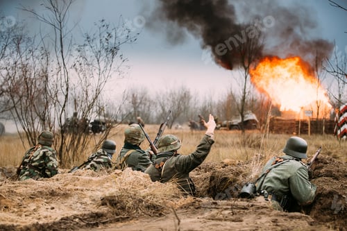 Preview: Defensive Position. Re-enactors Armed Rifles And Dressed As World War Ii German Wehrmacht Infantry