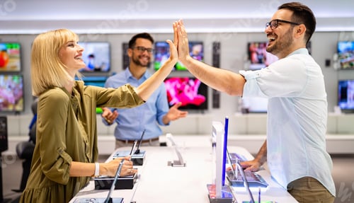 Preview: Shopping a new digital device. Happy couple buying a smartphone in store.