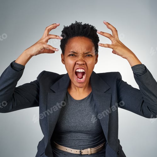 Preview: This is madness. Portrait of an angry businesswoman yelling against a grey background.