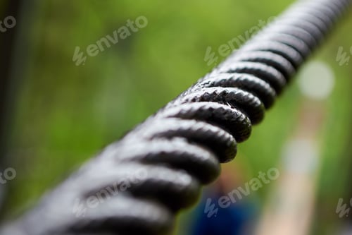 Preview: Close up steel cable that connects the suspension bridge on the river.