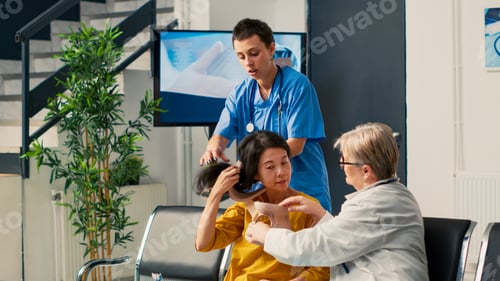 Preview: Medical staff taking cervical neck collar off of asian woman