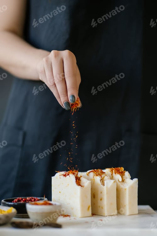 Preview: The girl sprinkles the soap with saffron