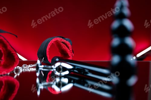 Preview: erotic bdsm toys for intimate sex games red soft handcuffs next to adult toys
